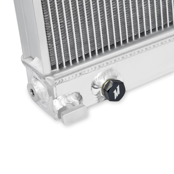 Aluminum radiator with an exit drain for coolant with a white background