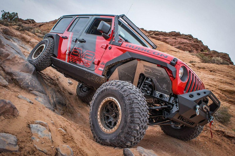 Red Jeep Flexing, demonstrating how the new fender gives room to go anywhere the jeep allows
