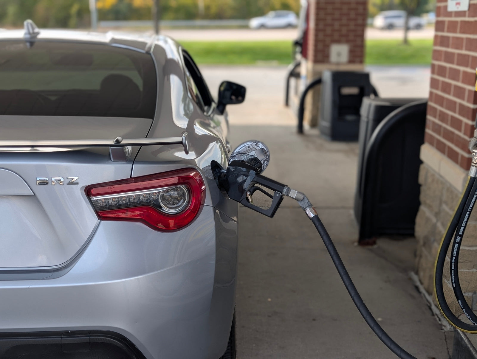 Silver BRZ sports car at gas station, refueling, LynXautoinnovate automotive parts USA