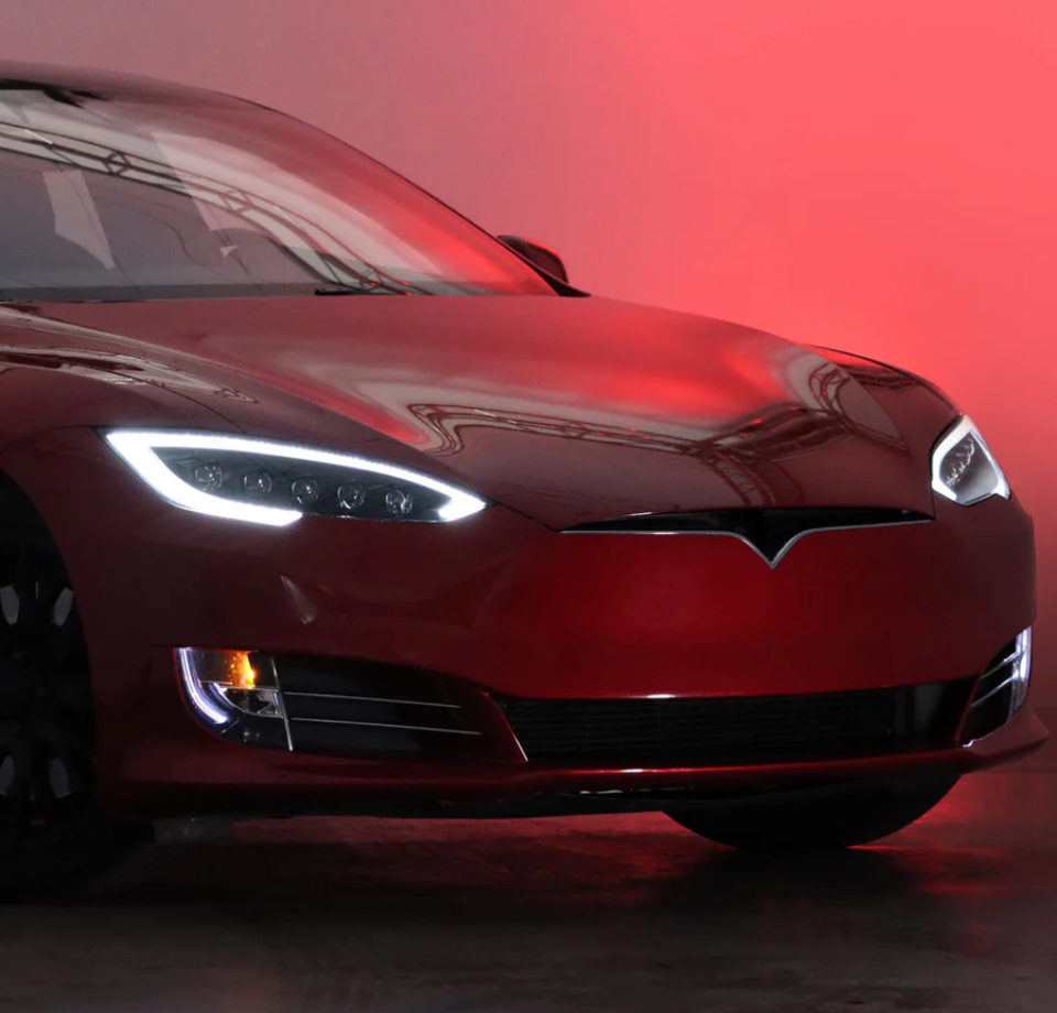 Red electric vehicle front view with LED headlights, LynXautoinnovate automotive parts USA