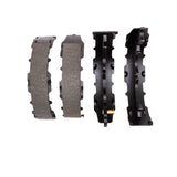 Set of brake pads and calipers on a white background