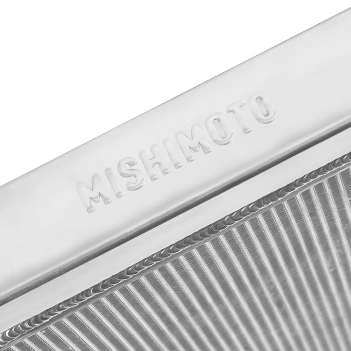 Close-up of a Mishimoto radiator with engraved branding with a white background
