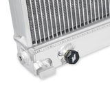Aluminum radiator with an exit drain for coolant with a white background