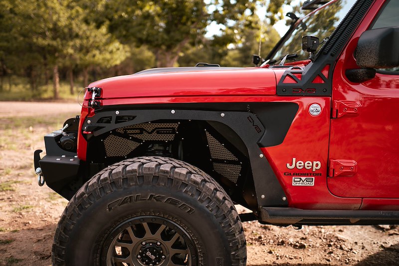 Side shot of the red jeep 