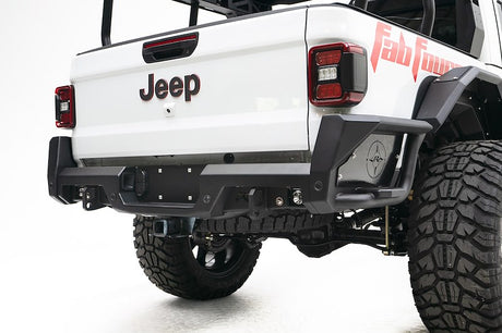 White Jeep vehicle with a visible 'Fabtech' logo on a white background